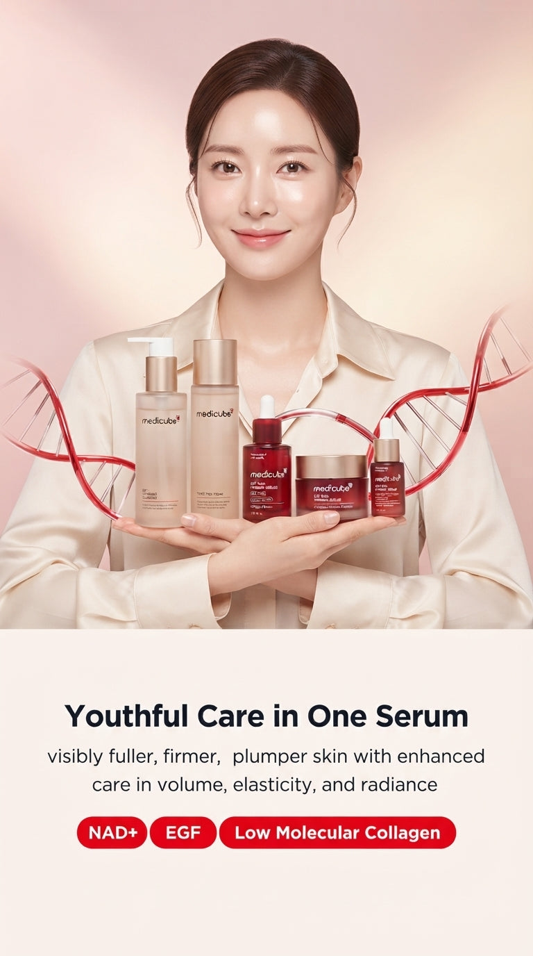 A woman with radiant glass skin holding a luxury 5-step skincare set against a soft blush pink and warm cream background.